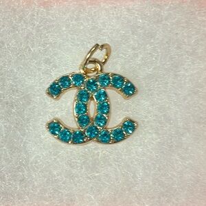 Chanel Crystal blue charm. Added necklace for you
